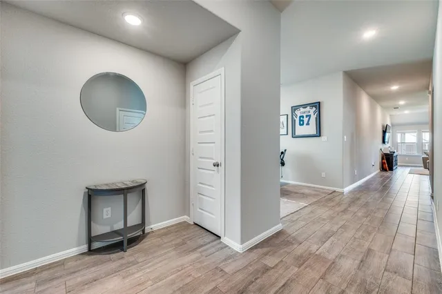 wooden floor in a hall with a mirror