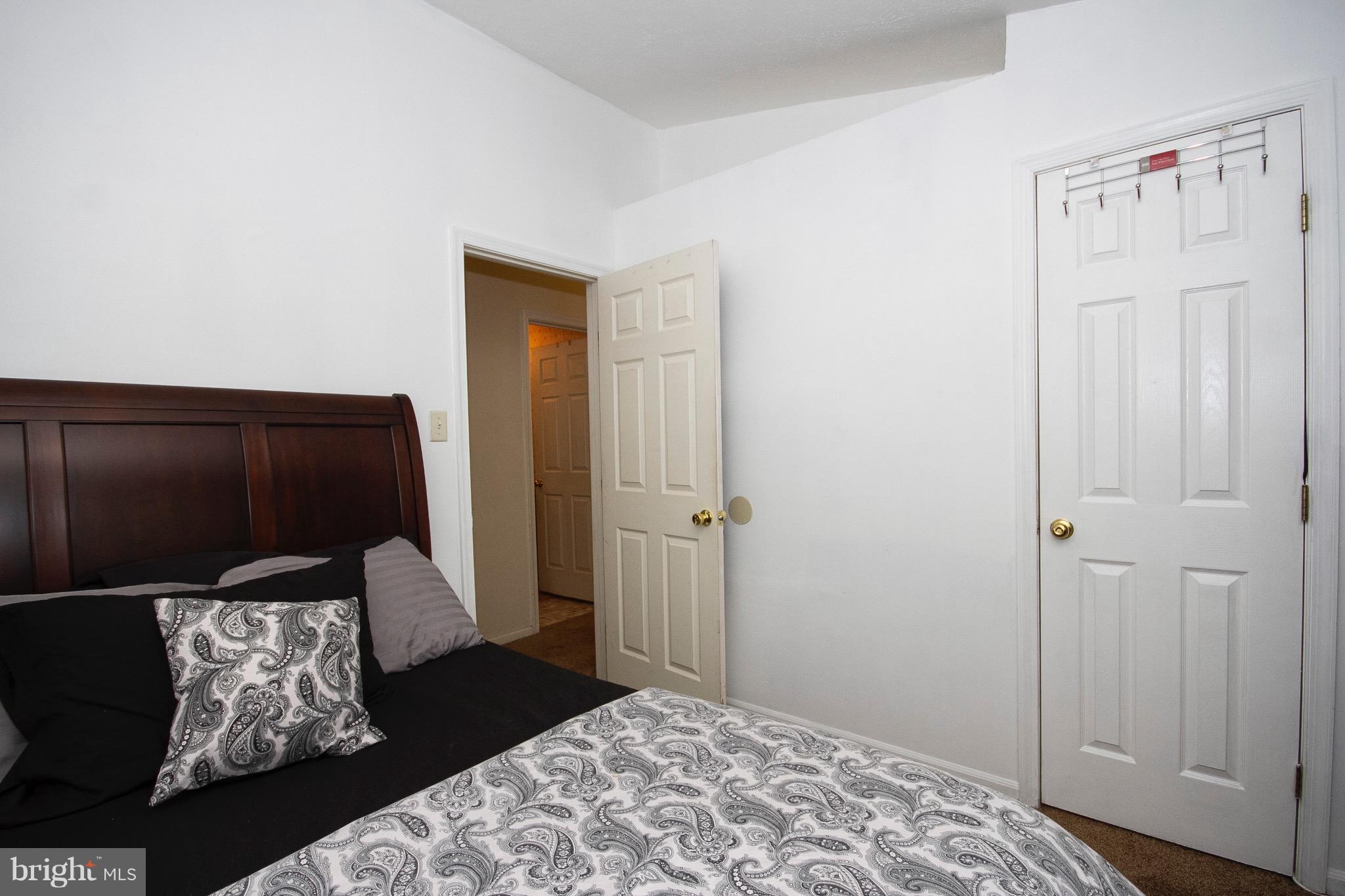 4201 Red Haven Road Baltimore, MD 21208 - Photo 12 of 29 a bedroom with a bed and a dresser