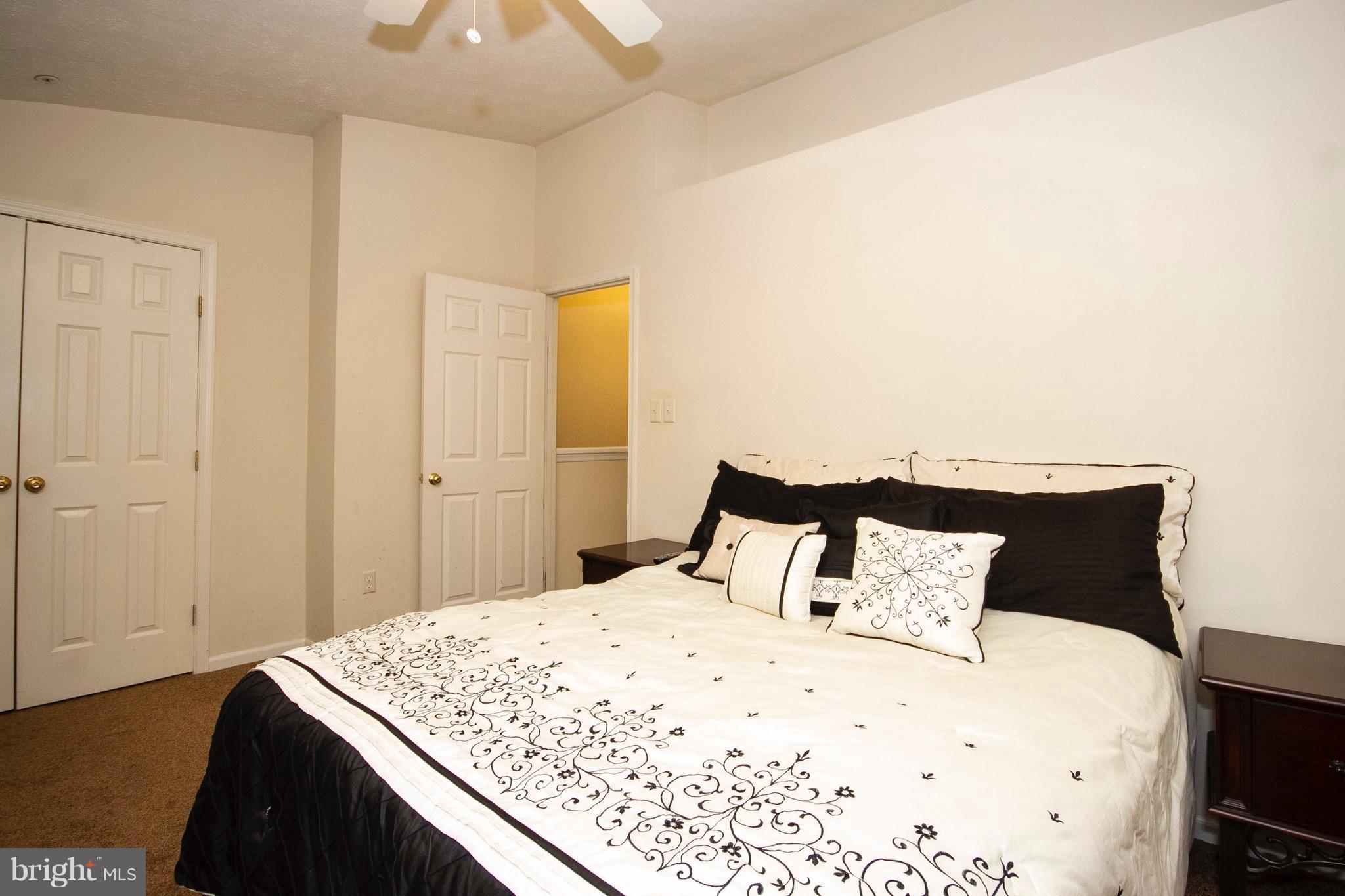 4201 Red Haven Road Baltimore, MD 21208 - Photo 16 of 29 a bedroom with a bed and a night stand