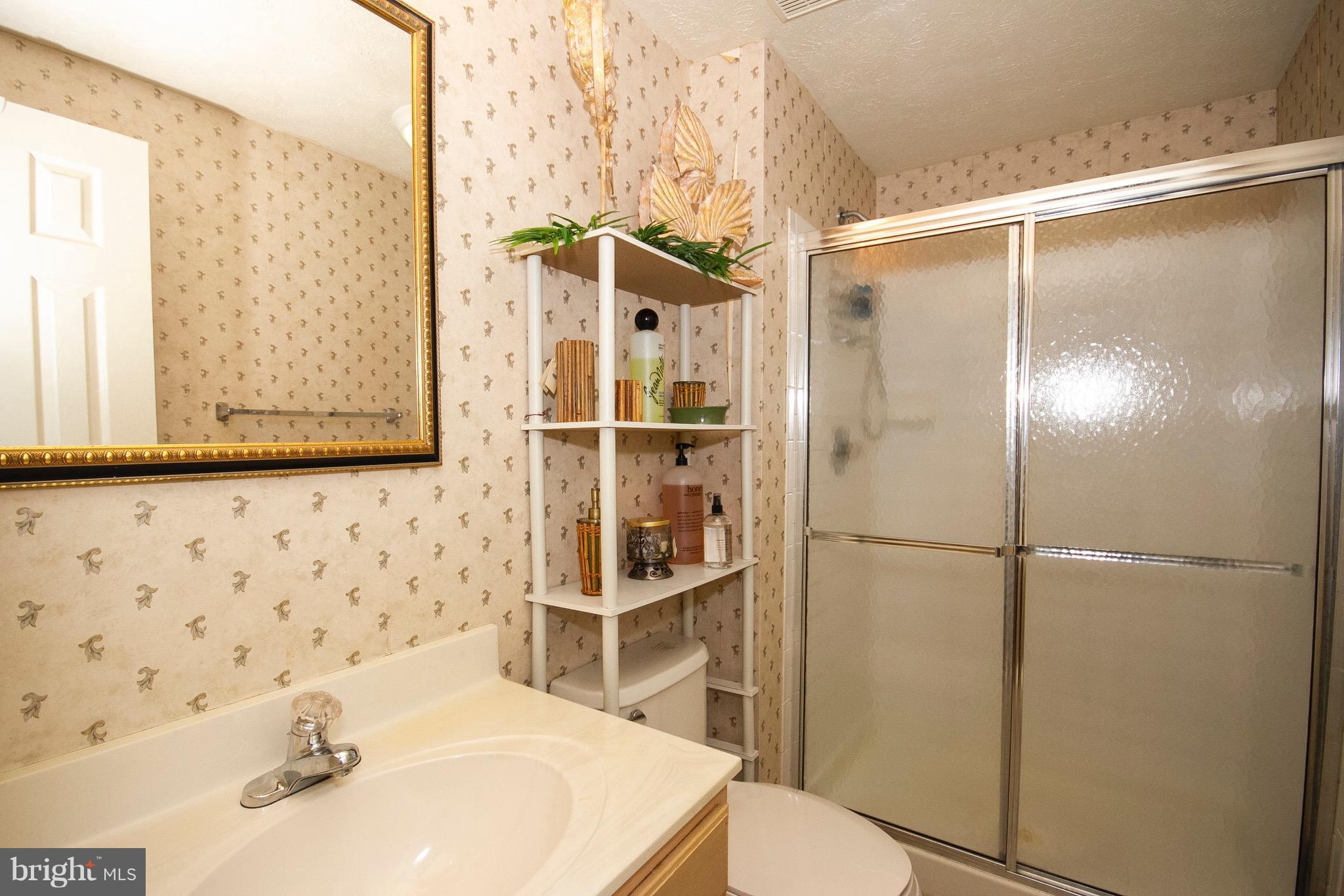 4201 Red Haven Road Baltimore, MD 21208 - Photo 19 of 29 a bathroom with a sink toilet and shower