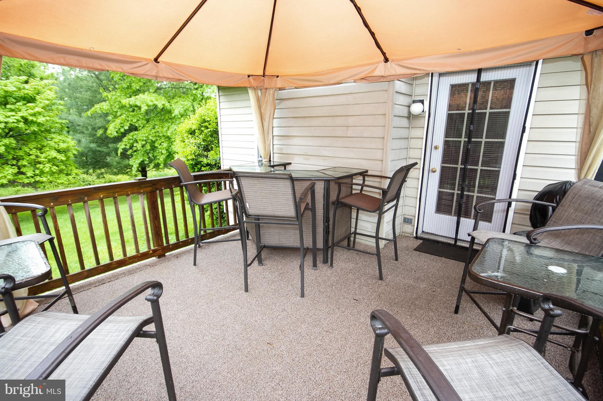 4201 Red Haven Road Baltimore, MD 21208 - Photo 27 of 29 a view of a patio with a table chairs and barbeque
