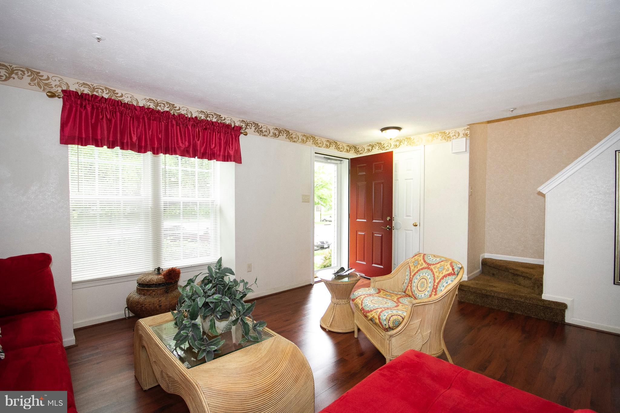 4201 Red Haven Road Baltimore, MD 21208 - Photo 5 of 29 a living room with furniture and a large window