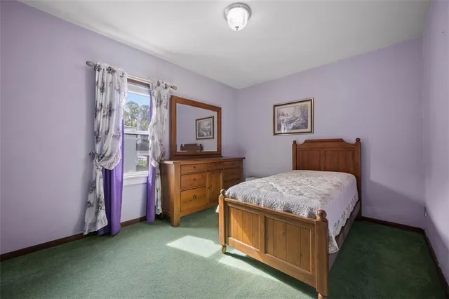 a view of a hallway with a room