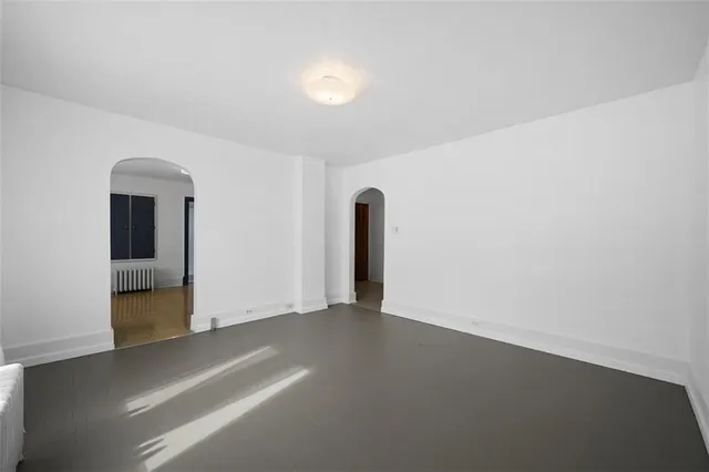 an empty room with closet area