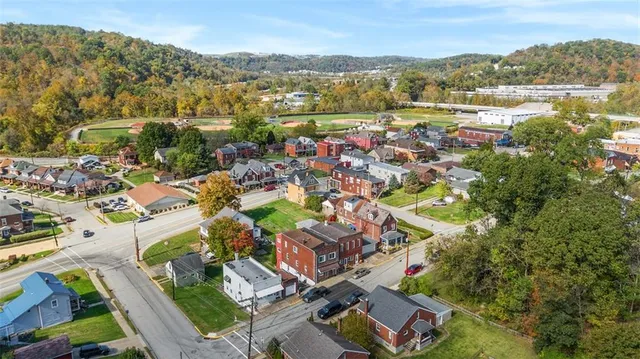an aerial view of residential house with outdoor space and river
