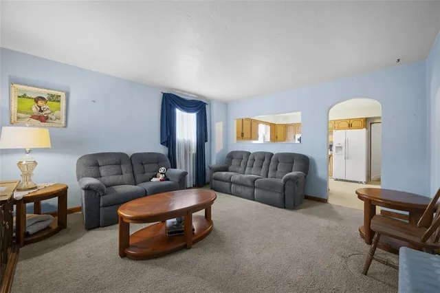 a living room with furniture and a couch