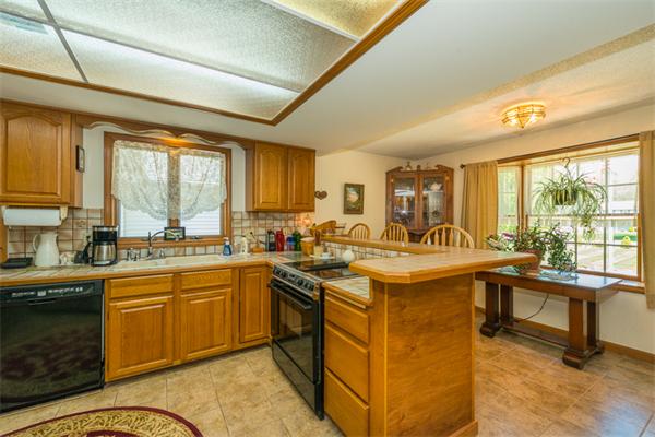 53 Baker Road Salisbury, MA 01952 - Photo 13 of 25 a kitchen with sink attached with living room