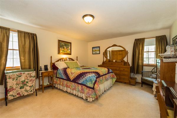 53 Baker Road Salisbury, MA 01952 - Photo 19 of 25 a spacious bedroom with a bed and window