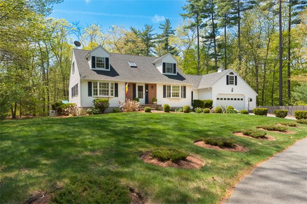 53 Baker Road Salisbury, MA 01952 - Photo 2 of 25 a front view of a house with a yard and trees