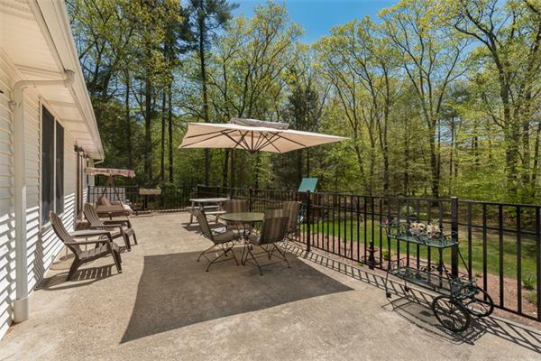 53 Baker Road Salisbury, MA 01952 - Photo 24 of 25 a view of backyard with outdoor seating and trees