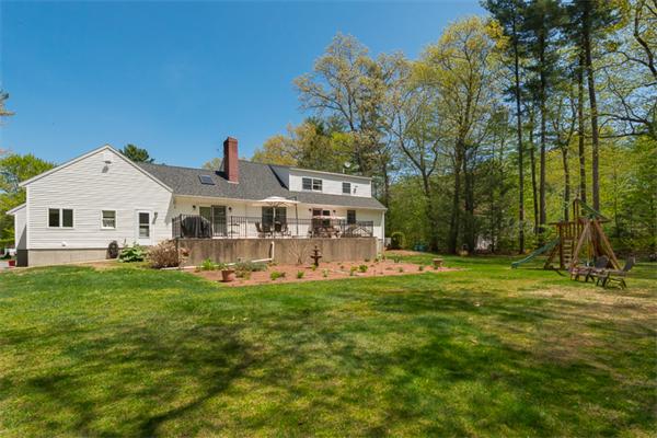 53 Baker Road Salisbury, MA 01952 - Photo 3 of 25 a view of a house with a big yard and large trees