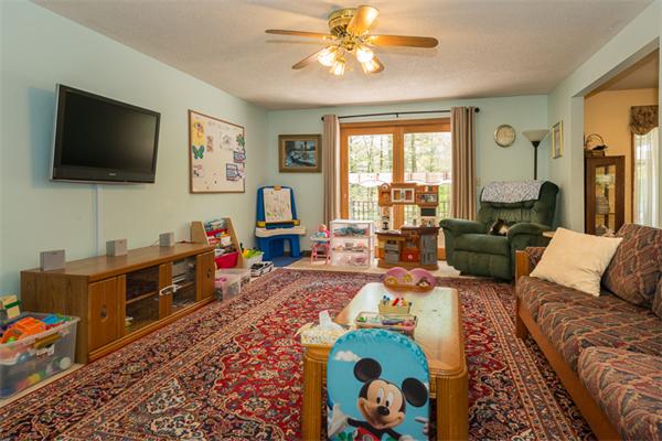 53 Baker Road Salisbury, MA 01952 - Photo 8 of 25 a living room with furniture and a flat screen tv