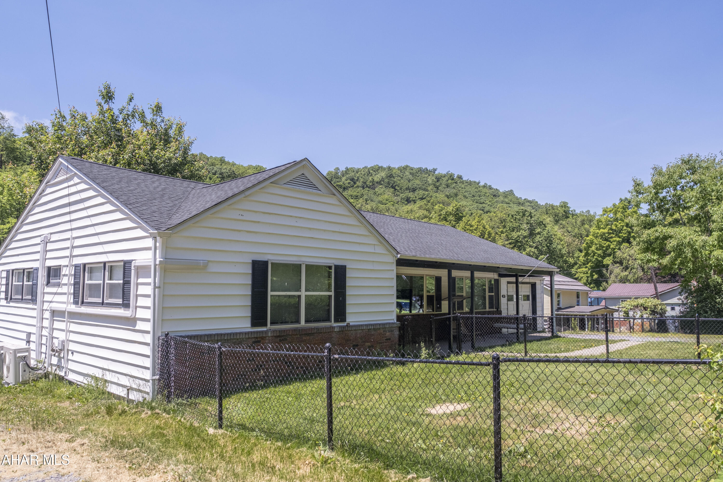 871 Decker Hollow Road Tyrone, PA 16686 - Photo 7 of 35 a front view of a house with a yard