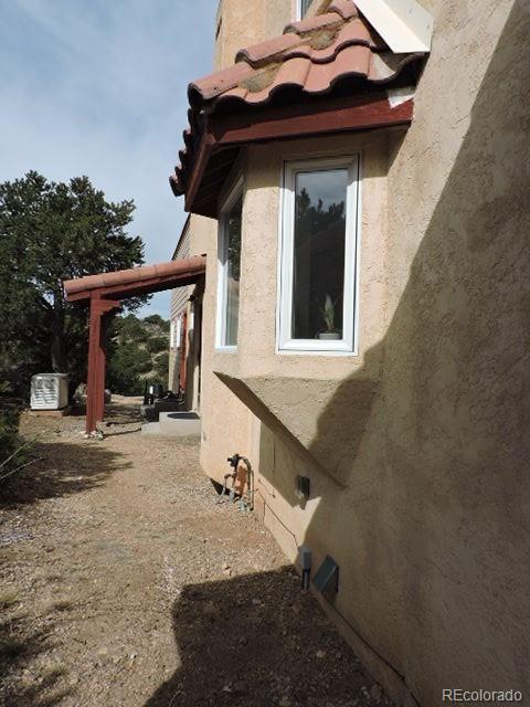3818 Fontaine Road Fort Garland, CO 81133 - Photo 34 of 50 a view of a house with a small yard and a large window