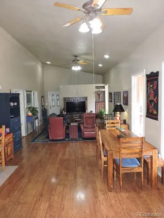 a bedroom with bed and a large window