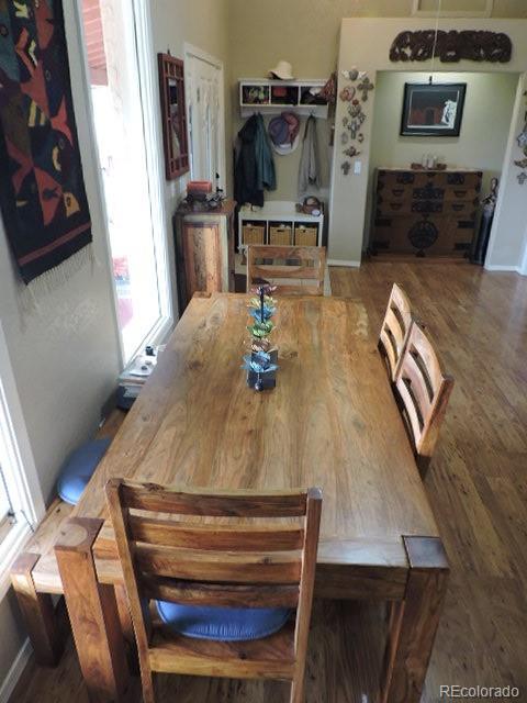 3818 Fontaine Road Fort Garland, CO 81133 - Photo 10 of 50 a room with wooden floor and furniture