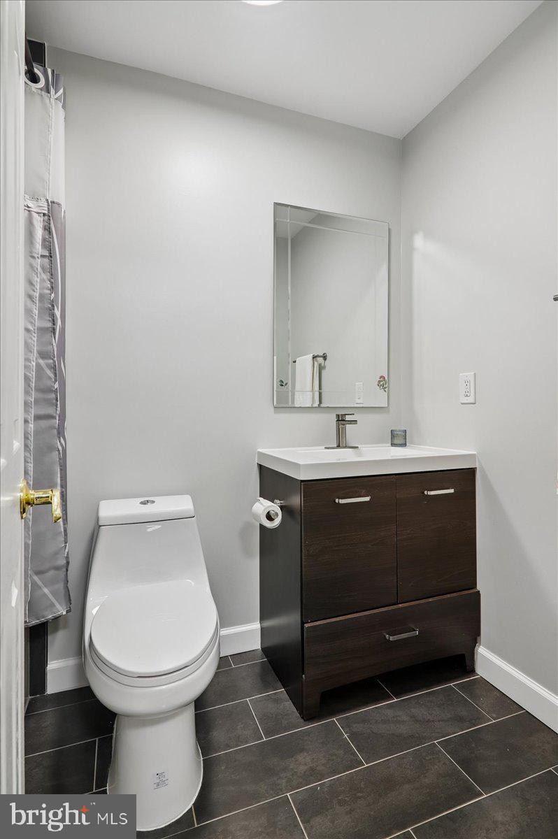 7408 Spring Tree Drive Springfield, VA 22153 - Photo 24 of 48 Sleek modern bathroom oasis.