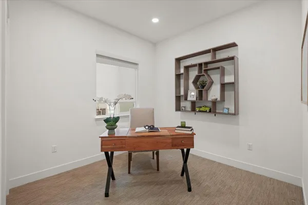 a room that has a table and a chair in it