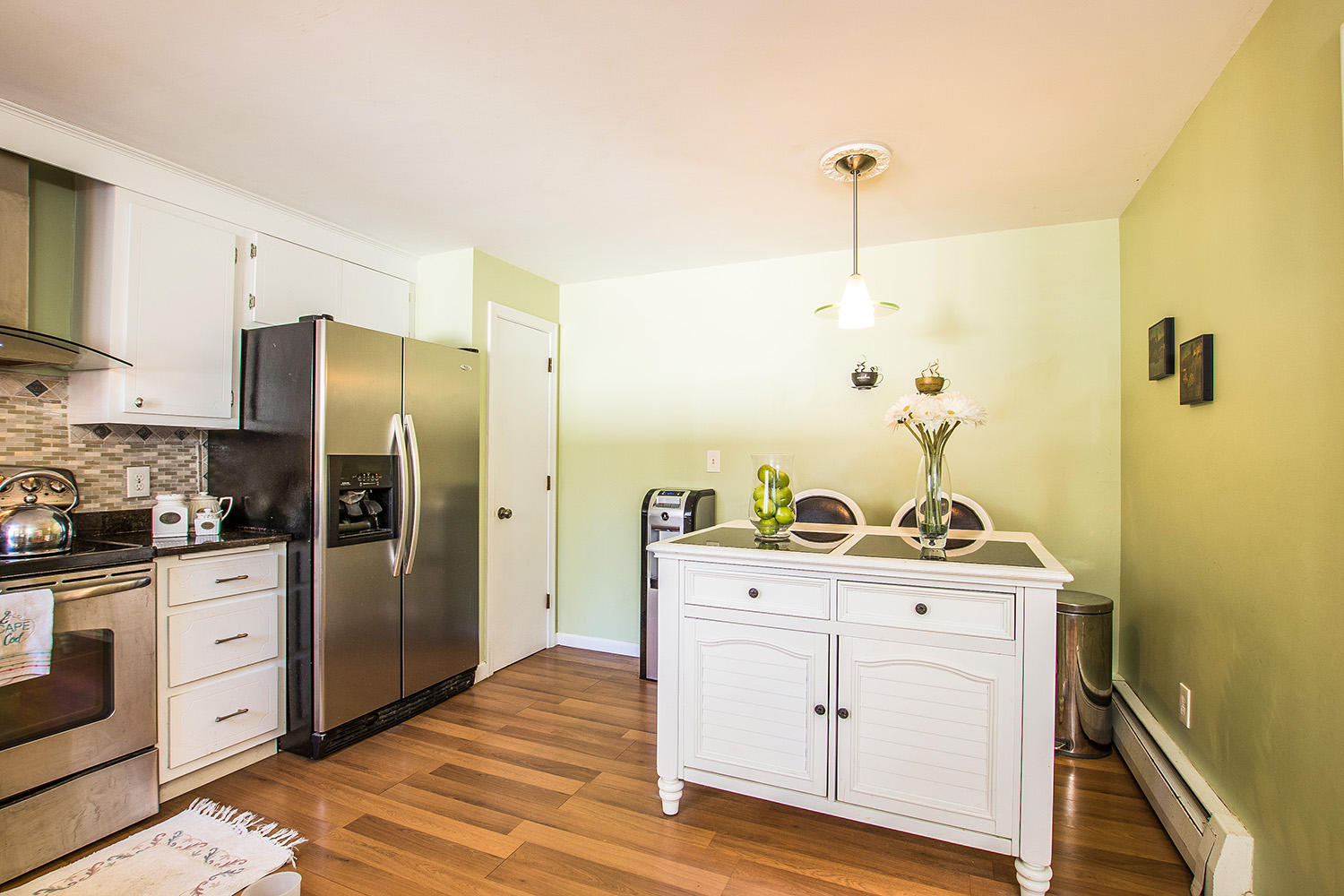 56 Wedgewood Drive Centerville, MA 02632 - Photo 13 of 34 a kitchen with stainless steel appliances a stove a refrigerator and cabinets