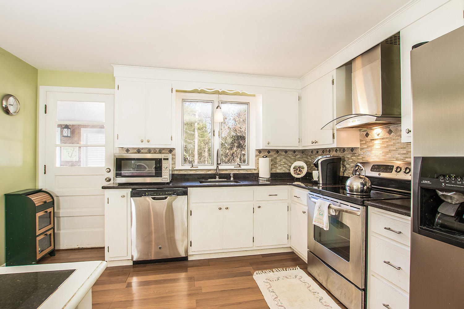 56 Wedgewood Drive Centerville, MA 02632 - Photo 14 of 34 a kitchen with cabinets appliances a sink and a window