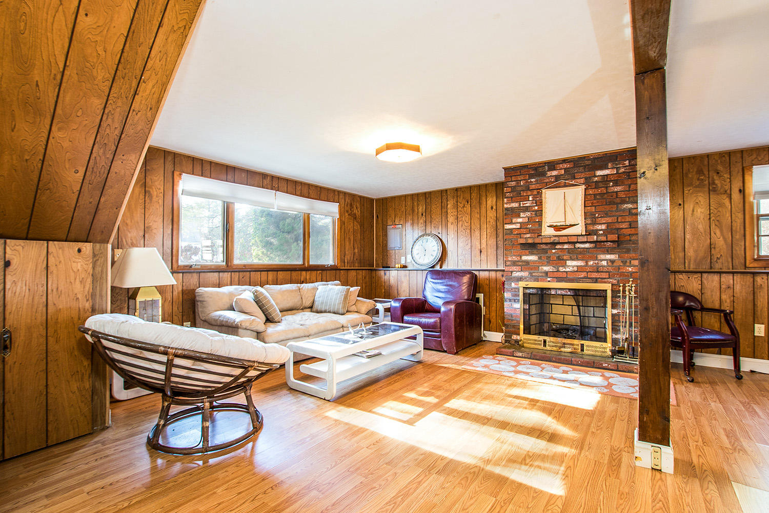 56 Wedgewood Drive Centerville, MA 02632 - Photo 26 of 34 a living room with furniture a flat screen tv and floor to ceiling window