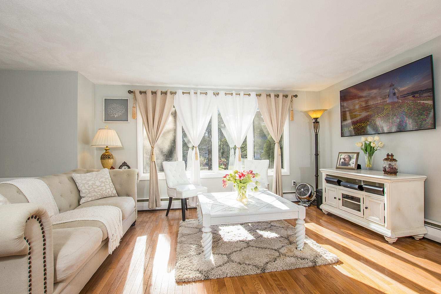 56 Wedgewood Drive Centerville, MA 02632 - Photo 7 of 34 a living room with furniture and a large window