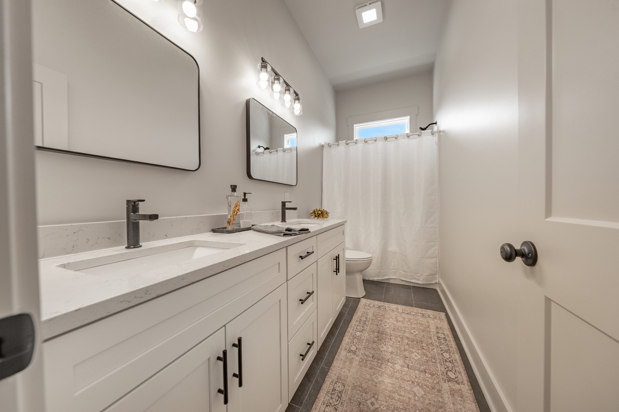 4031 Wells Road Springfield, TN 37172 - Photo 22 of 39 a bathroom with a double vanity sink and mirror