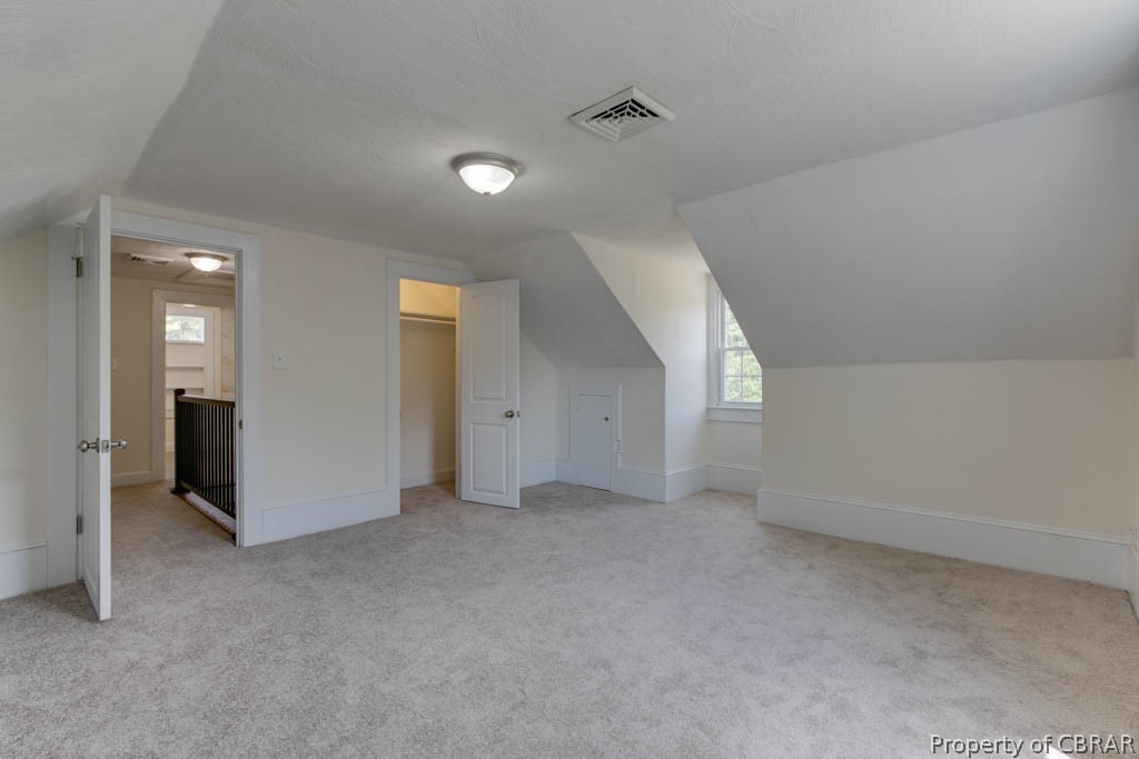 400 Showalter Road Yorktown, VA 23692 - Photo 37 of 49 Bonus room with lofted ceiling and light colored carpet