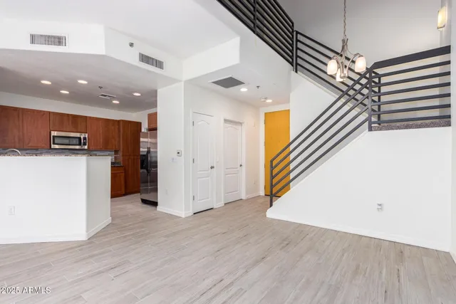 a view of a kitchen with a sink and an oven