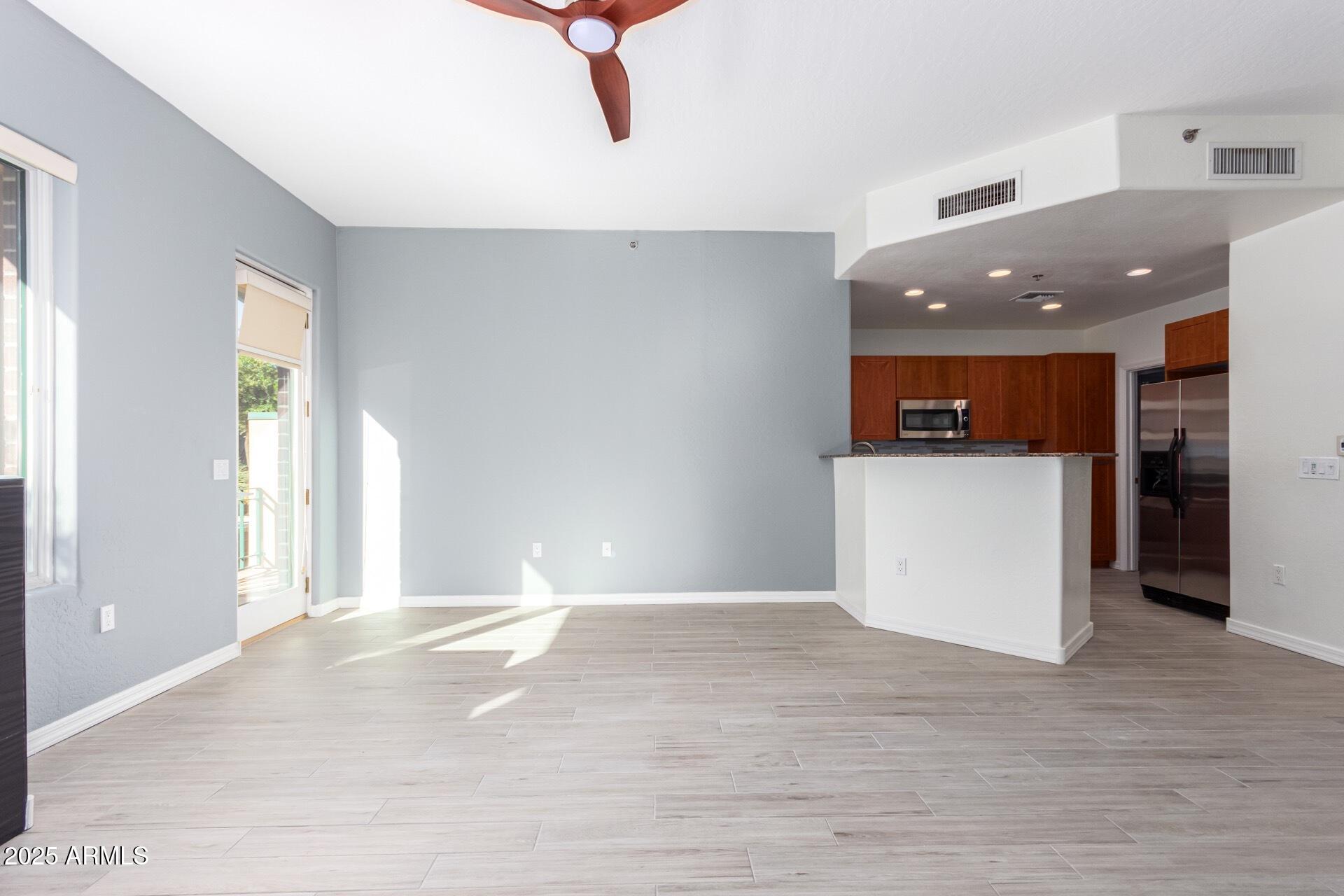 17 West Vernon Avenue, Unit 117 Phoenix, AZ 85003 - Photo 13 of 38 a view of a kitchen with a sink and a refrigerator