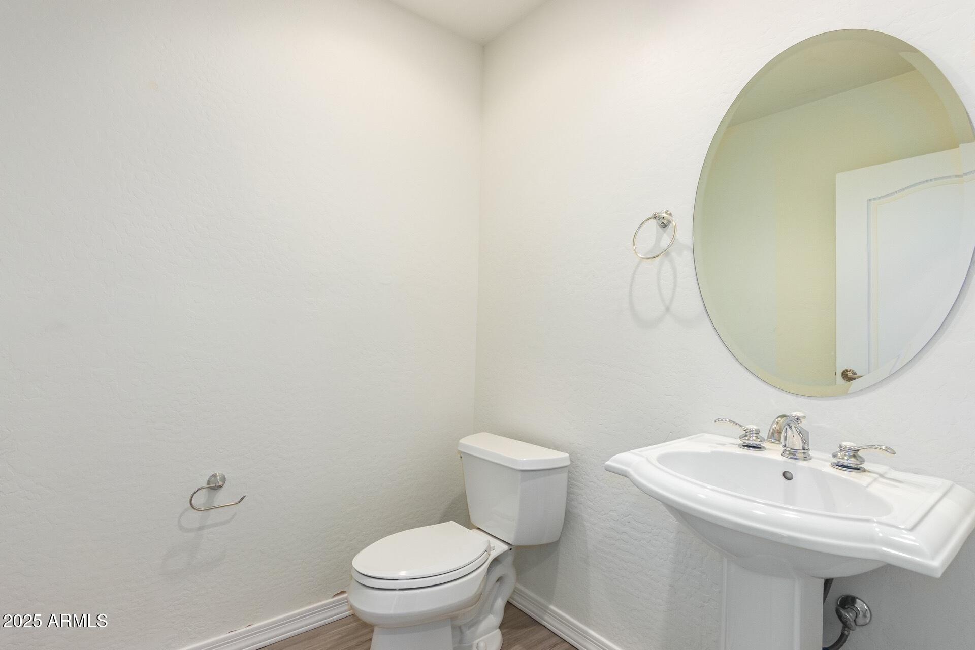 17 West Vernon Avenue, Unit 117 Phoenix, AZ 85003 - Photo 18 of 38 a bathroom with a sink a mirror and toilet