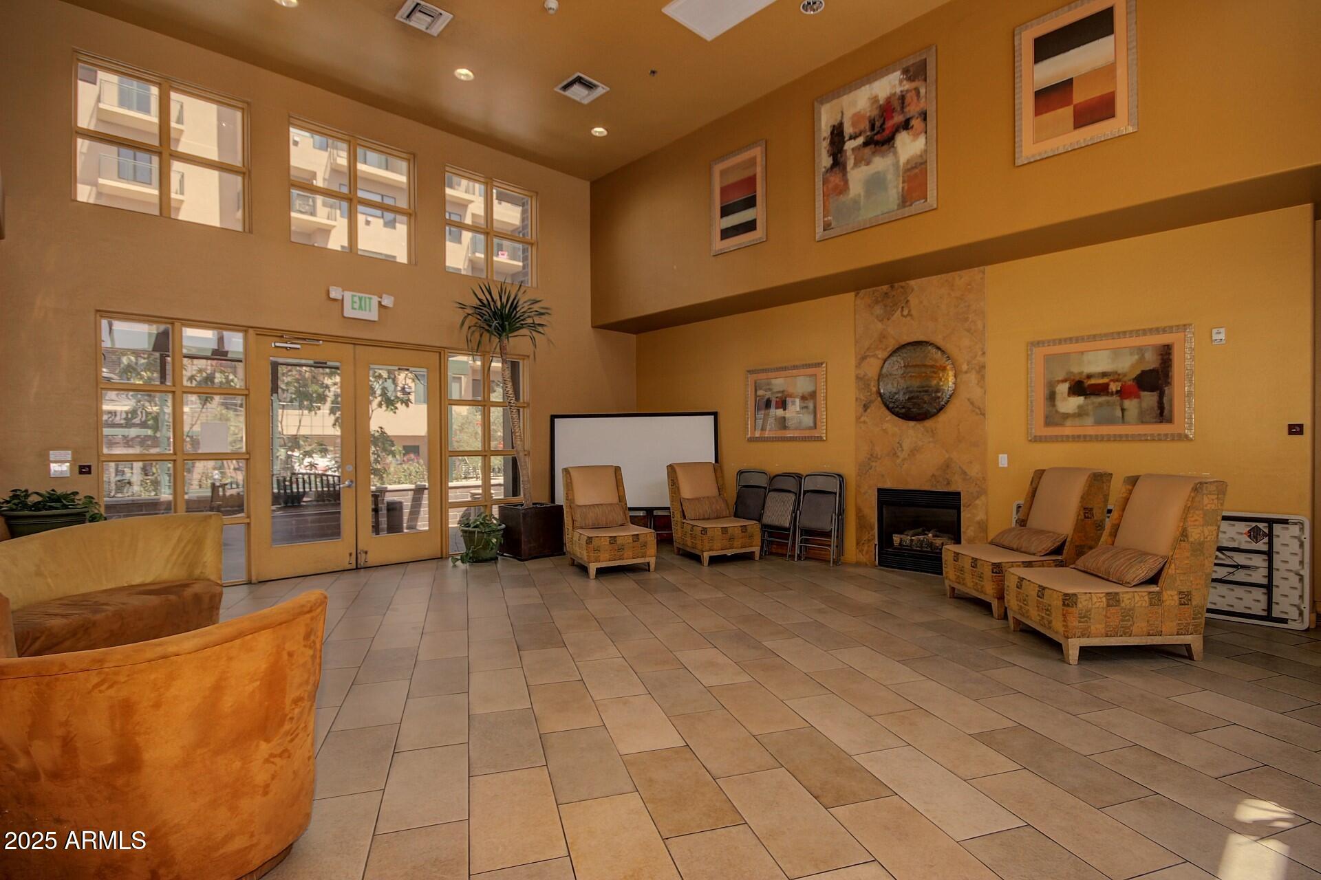 17 West Vernon Avenue, Unit 117 Phoenix, AZ 85003 - Photo 29 of 38 a living room with furniture and a fireplace