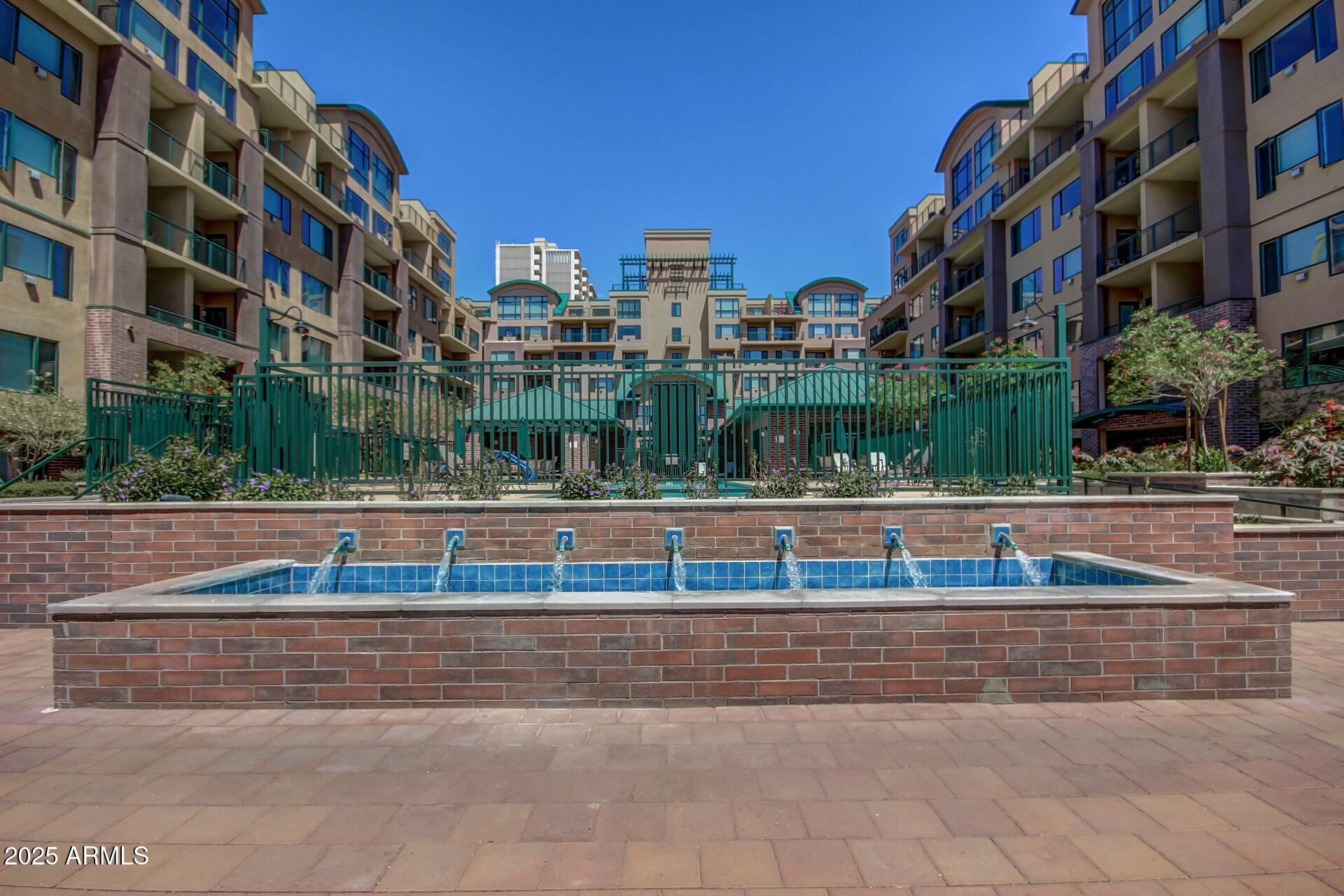 17 West Vernon Avenue, Unit 117 Phoenix, AZ 85003 - Photo 35 of 38 a view of building with view of lake
