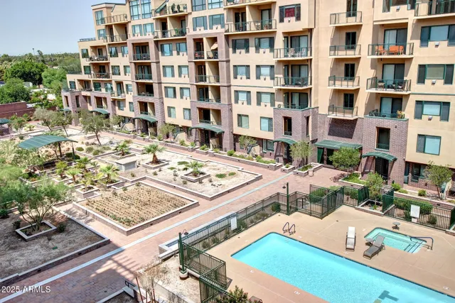 a picture of a living room with a book shelf