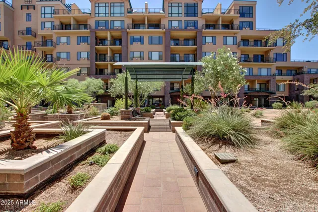 a view of multiple houses with a yard