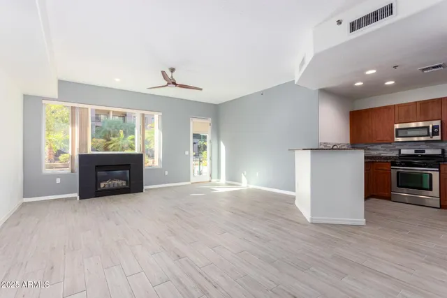 a view of kitchen with furniture and a fireplace