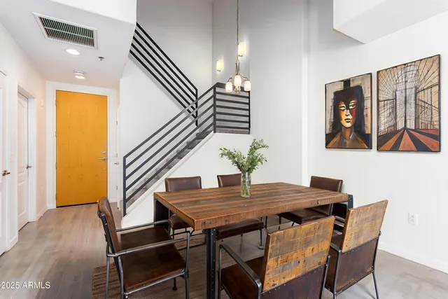 a view of a dining room with furniture and wooden floor