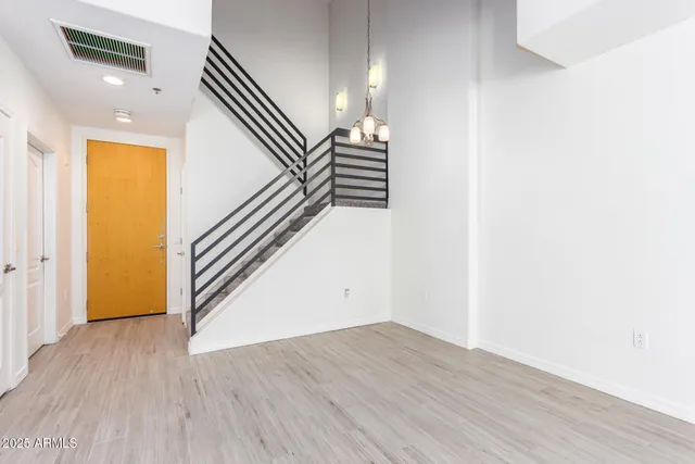 a view of a room with wooden floor