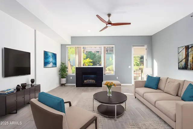 a living room with furniture and a flat screen tv