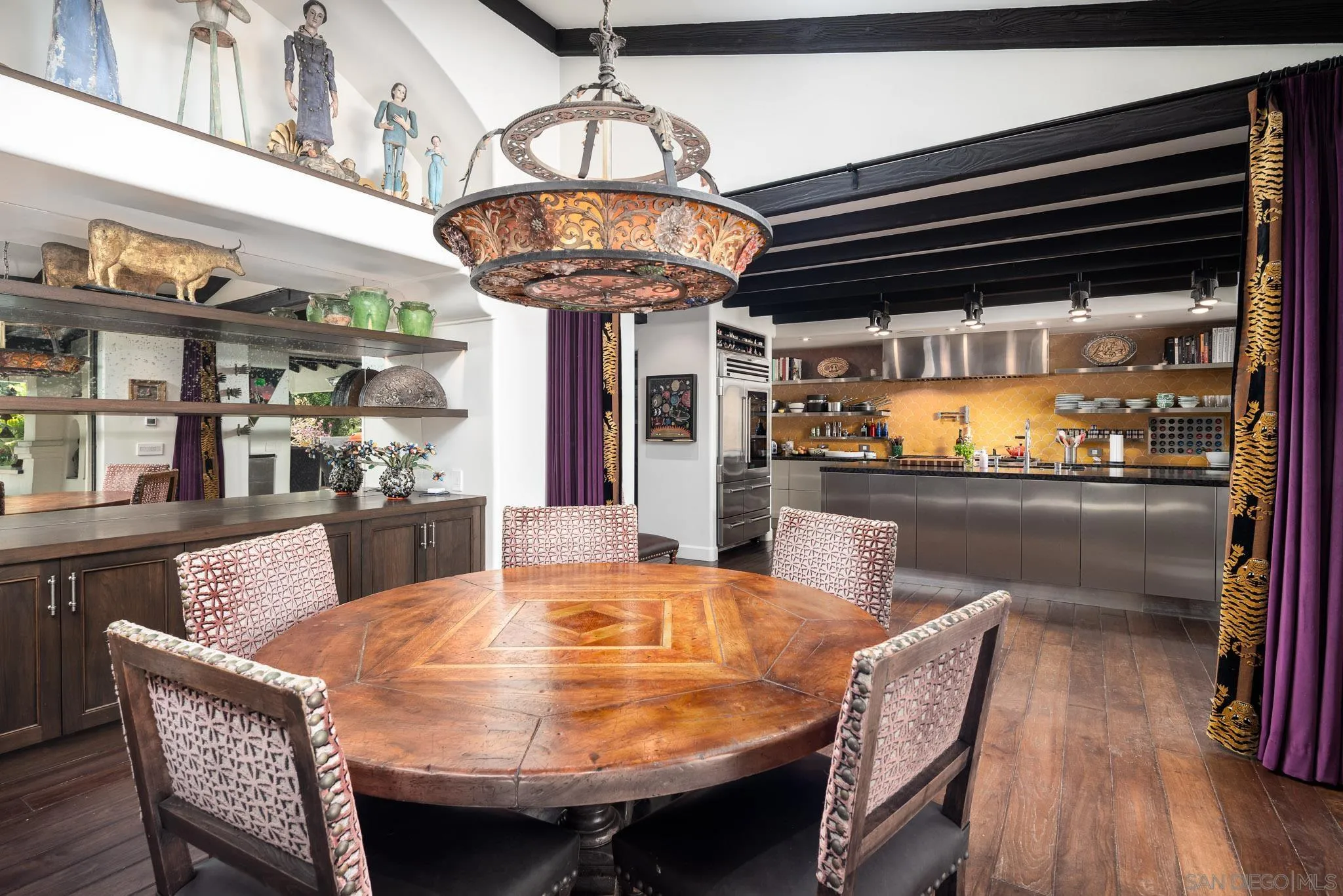 18245 Paseo Victoria Rancho Santa Fe, CA 92067 - Photo 13 of 40 a dining room with furniture and chandelier