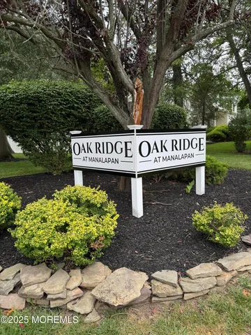 a street sign on a pole on a sidewalk