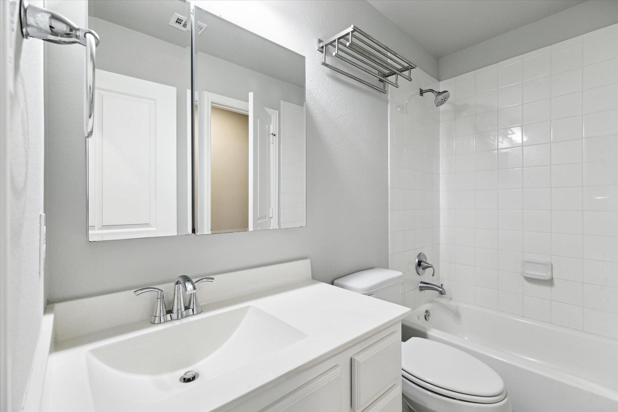 1010 Bat Hawk Court Conroe, TX 77385 - Photo 35 of 50 a bathroom with a sink toilet and shower