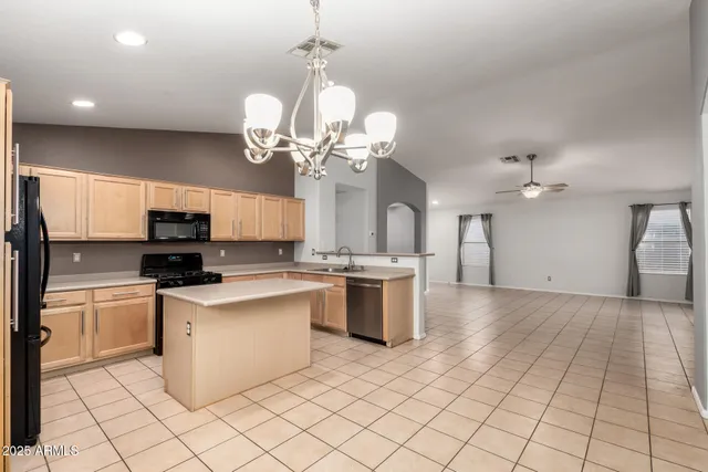 a view of a kitchen with microwave and cabinets