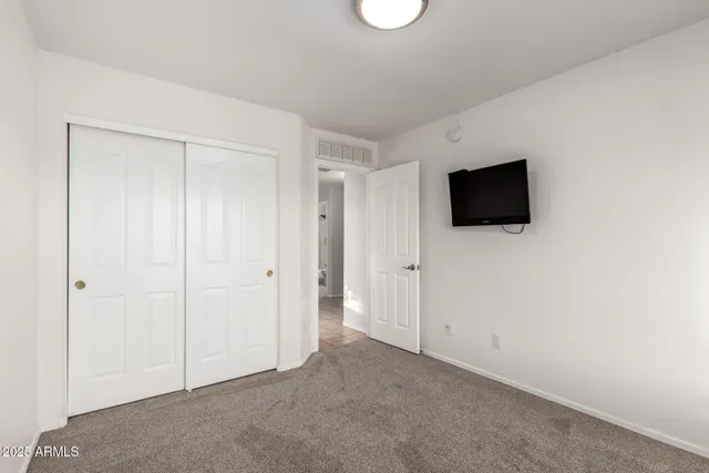 a view of a livingroom with a flat screen tv
