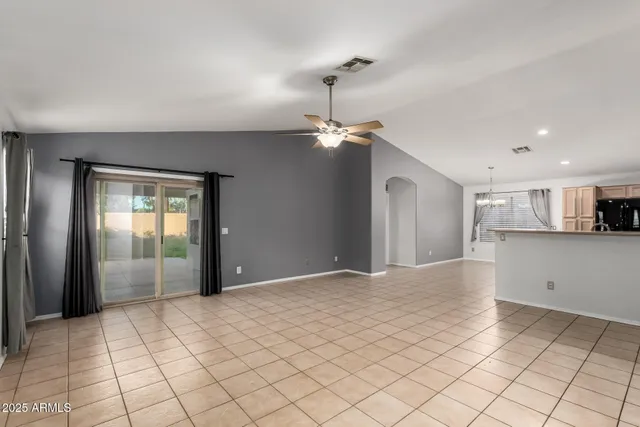 a view of a kitchen with a sink and a refrigerator window