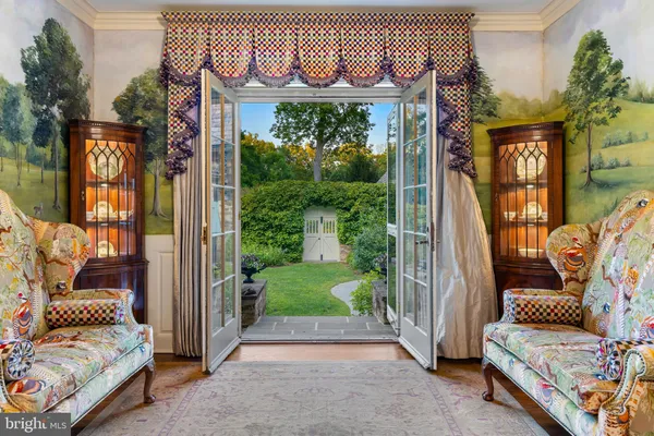a view of a lush green forest with lots of trees