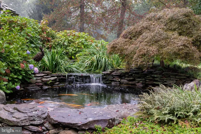 a view of a house with swimming pool garden and patio