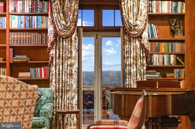 a kitchen with kitchen island white cabinets and stainless steel appliances