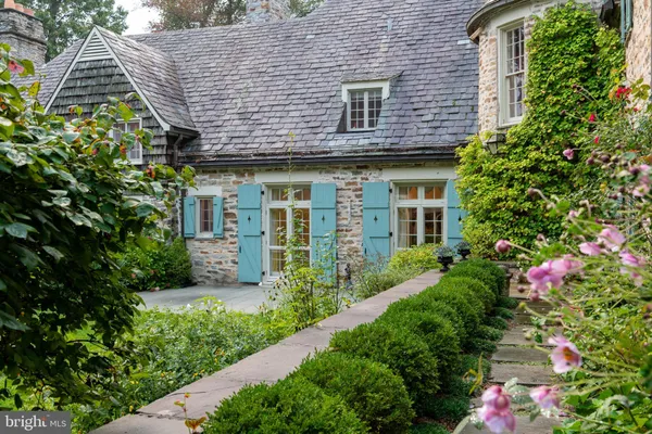 an aerial view of a house with outdoor space
