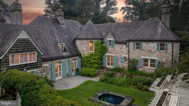 an aerial view of a house with outdoor space